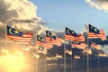 Pretty day of flag 3d illustration - many Malaysia flags on sunset placed in row with soft focus and place for your content