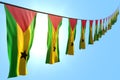 nice feast flag 3d illustration - many Sao Tome and Principe flags or banners hangs diagonal on rope on blue sky background with