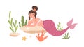 Pretty mermaid with hair bun and pink fish tail lying and resting at sea bed. Beautiful underwater fairy princess