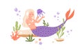 Pretty mermaid with long blonde hair and fish tail playing with jellyfish at sea bed. Cute underwater fairy princess