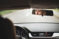 Pretty midle aged woman at the steering wheel of her car