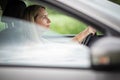 Pretty midle aged woman at the steering wheel of her car Royalty Free Stock Photo
