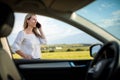 Pretty midle aged woman having a break on a long trip, making a phone call