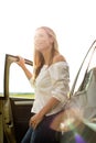 Pretty midle aged woman at the steering wheel of her car