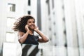 Pretty mixed race businesswoman speak by phone in city Royalty Free Stock Photo