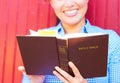 Pretty Mixed Race Woman Reading Holy Bible Royalty Free Stock Photo