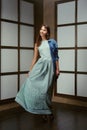 Pretty model demonstrating outfit - long cotton dress and jeans jacket