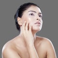 Pretty model touching her skin face Royalty Free Stock Photo