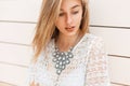 Pretty modest woman in vintage lace blouse standing near Royalty Free Stock Photo