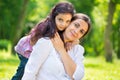 Pretty mother with daughter at summer park Royalty Free Stock Photo