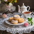 A pretty Mothers\' Day or Easter high tea with petit-four biscuits.