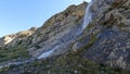 pretty mountain ridge high land fast water fall at summertime day - photo of nature