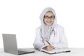 Pretty muslim doctor smiling at camera Royalty Free Stock Photo