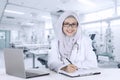 Pretty muslim doctor smiling in hospital