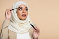 pretty muslim woman in hijab applying Royalty Free Stock Photo