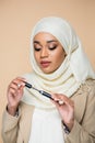 pretty muslim woman in hijab holding Royalty Free Stock Photo