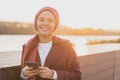 Portrait muslim woman wearing hijab using mobile phone outdoor. Arabic woman wearing headscarf using smartphone on