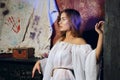 Pretty mystic lady in gothic white dress in underground dungeon