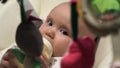 Pretty nice baby drink milk from the bottle and look into camera.