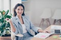 Pretty, nice, cute, perfect woman sitting at her desk on leather Royalty Free Stock Photo