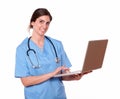 Pretty nurse smiling while using her laptop Royalty Free Stock Photo