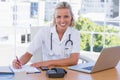 Pretty nurse working in her office Royalty Free Stock Photo