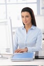 Pretty office worker at desk Royalty Free Stock Photo