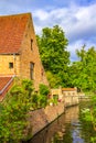 Pretty old canalside houses Bruges city view at summer day Belgium Royalty Free Stock Photo