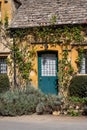 Pretty old stone cottage in the unspoilt picturesque Cotswold village of Stanton in Gloucestershire UK. Royalty Free Stock Photo