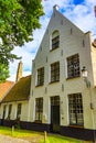 Pretty old white house Bruges city view at summer day Belgium Royalty Free Stock Photo