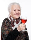 Pretty old woman with glass of wine Royalty Free Stock Photo