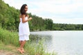 Pretty girl walking by water Royalty Free Stock Photo