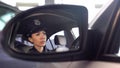 Pretty patrolwoman sitting in car, patrolling and monitoring city law and order