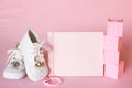 Pretty Pink Baby Girl Shower Invitation Card or Birth Announcement with vintage white shoes on Pink Cloth Background with room or