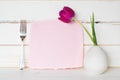 Pretty Pink Card with Purple Tulip Flower in Modern Vase with Fork against white Shiplap board wall and table.