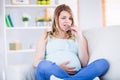 Pretty pregnant woman eating chocolate Royalty Free Stock Photo