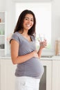 Pretty pregnant woman holding a glass Royalty Free Stock Photo