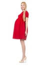 Pretty pregnant woman in red dress isolated on Royalty Free Stock Photo