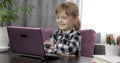 Girl studying online homework using digital laptop computer. Distance education Royalty Free Stock Photo