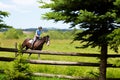 Preteen girl riding a Kentucky Mountain horse in a practice field with another rider in the background Royalty Free Stock Photo