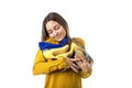 Pretty proud young woman holding many shoes over white background Royalty Free Stock Photo