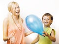 Pretty real family with color balloons on white background, blond woman with little boy at birthday party bright smiling Royalty Free Stock Photo