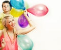 Pretty real family with color balloons on white background, blond woman with little boy at birthday party bright smiling Royalty Free Stock Photo