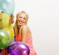 pretty real family with color balloons on white background, blond woman with little boy at birthday party bright smiling Royalty Free Stock Photo