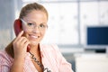 Pretty receptionist working talking on phone