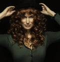 Pretty red-haired girl with curls with frackles, black hat Royalty Free Stock Photo