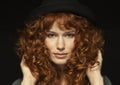 Pretty red-haired girl with curls, freckles Royalty Free Stock Photo