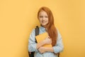 Pretty red haired school girl isolated