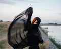 pretty red-haired woman in black dress outdoors posing fresh air Royalty Free Stock Photo