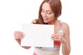 Pretty red-haired woman holding paper board Royalty Free Stock Photo